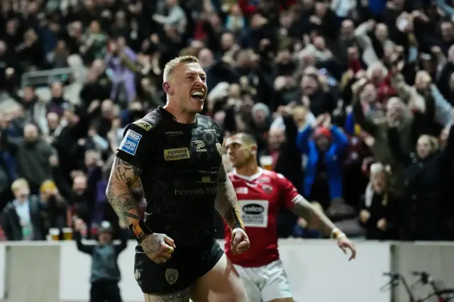 Leigh's Josh Charnley celebrates scoring his try against Salford