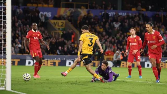 Rayan Ait-Nouri of Wolverhampton Wanderers scores a goal to make it 1-1 during the Premier League match between Wolverhampton Wanderers FC and Liverpool FC at Molineux on September 28, 2024 in Wolverhampton, England.