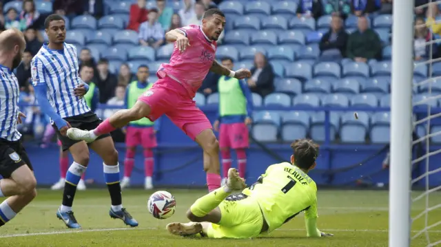 Sheffield Wednesday's James Beadle (1) saves from West Bromwich Albion's Karlan Grant (18)