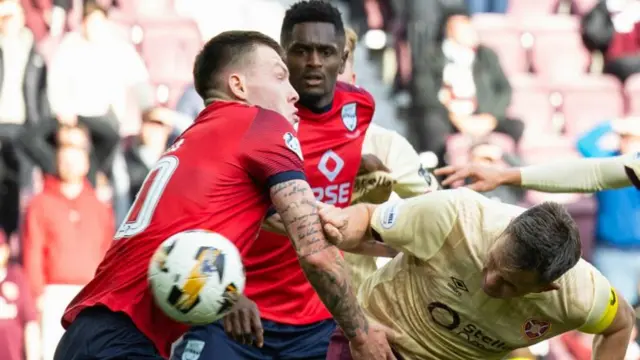 Lawrence Shankland scores for Hearts against Ross County