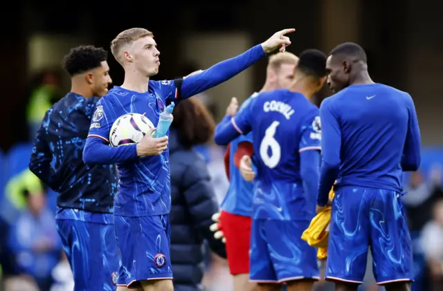 Cole Palmer holding the match ball after his four goals