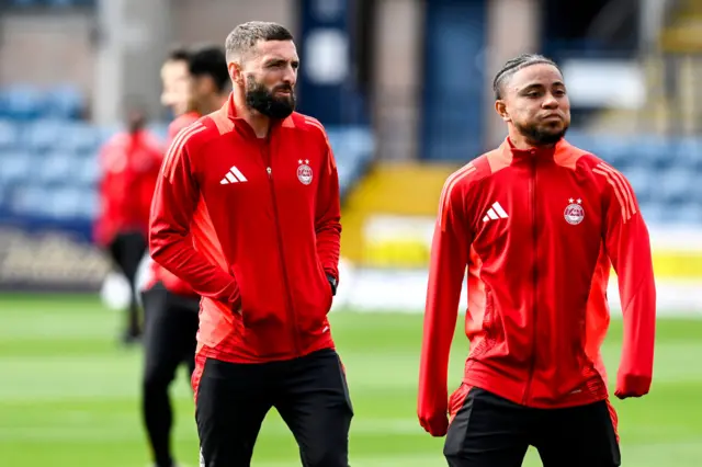 DUNDEE, SCOTLAND - SEPTEMBER 28: Aberdeen's Graeme Shinnie and Vicente Besuijen pre-match during a William Hill Scottish Premiersihp match between Dundee FC and Aberdeen at the Scot Foam Stadium at Dens Park, on September 28, 2024, in Dundee, Scotland. (Photo by Rob Casey / SNS Group)