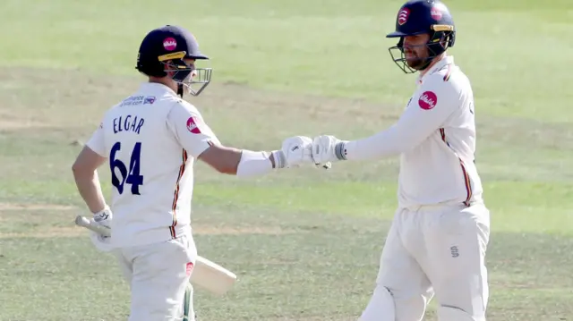 Dean Elgar and Matt Critchley bump fists