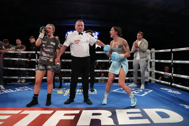 Rhiannon Dixon reacts as Terri Harper celebrates having her hand raised