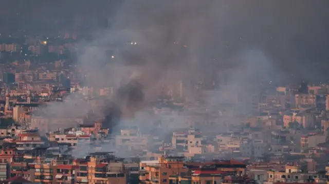 Smoke over the buildings of Beirut's southern suburbs