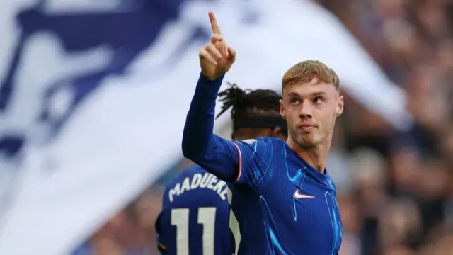 Cole Palmer of Chelsea celebrates scoring his team's third goal and his hat trick during the Premier League match between Chelsea FC and Brighton & Hove Albion FC at Stamford Bridge on September 28, 2024 in London, England.