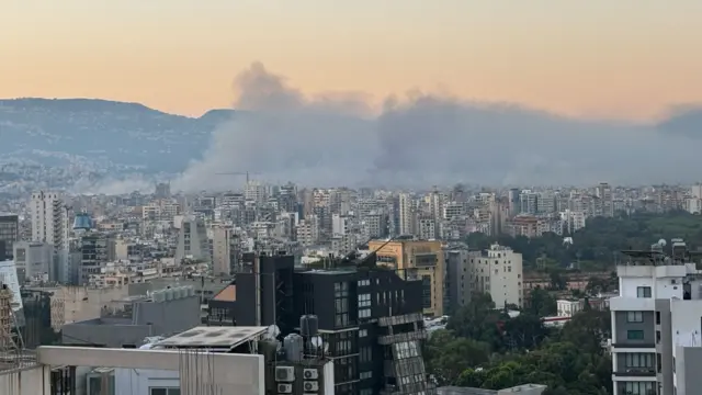 Thick smoke rising above buildings in Dahieh