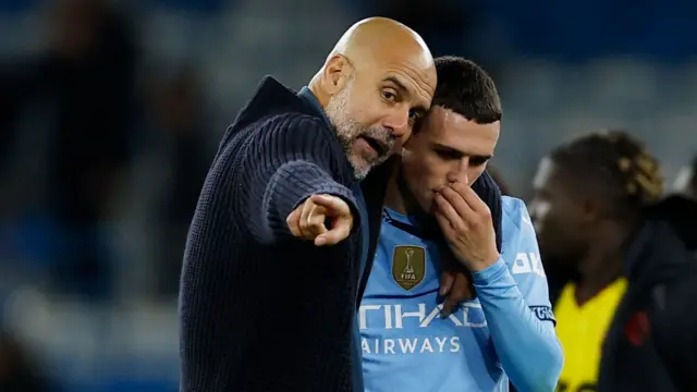 Pep Guardiola and Phil Foden