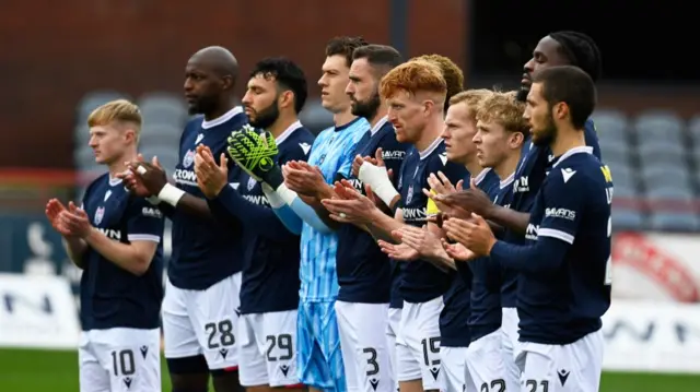 DUNDEE, SCOTLAND - SEPTEMBER 28: Dundee players during a minutes applause in memory of former Dundee forward Fabian Caballero who passed away aged 46 during a William Hill Scottish Premiersihp match between Dundee FC and Aberdeen at the Scot Foam Stadium at Dens Park, on September 28, 2024, in Dundee, Scotland. (Photo by Rob Casey / SNS Group)