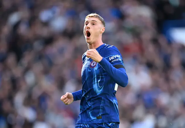 Cole Palmer of Chelsea celebrates scoring his team's first goal during the Premier League match between Chelsea FC and Brighton & Hove Albion FC at Stamford Bridge on September 28, 2024 in London, England.