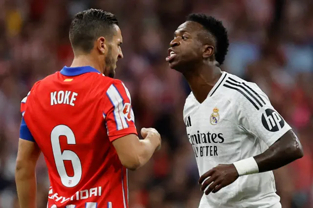 Vinicius Junior discusses with Atletico Madrid's Spanish midfielder Koke