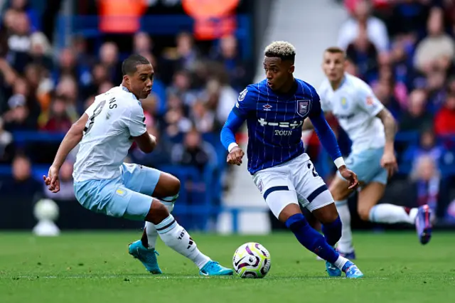 Omari Hutchinson vies for the ball with Aston Villa's Belgian midfielder #08 Youri Tielemans