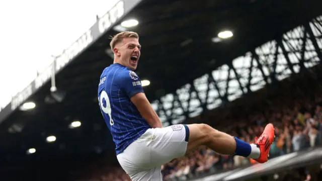 : Liam Delap of Ipswich Town celebrates scoring his team's first goal during the Premier League match between Ipswich Town FC and Aston Villa FC at Portman Road on September 29, 2024 in Ipswich, England.