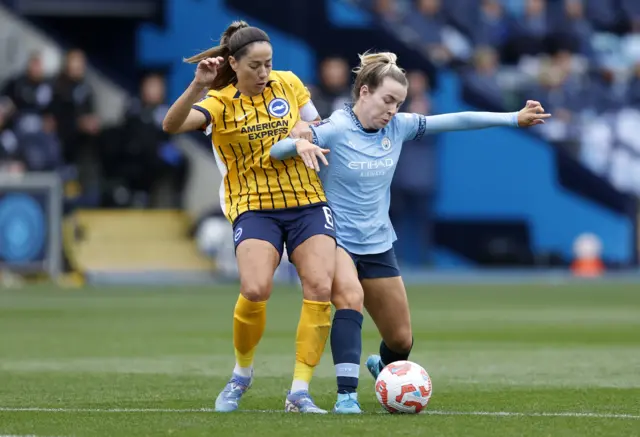 Vicky Losada and Lauren Hemp battle for the ball