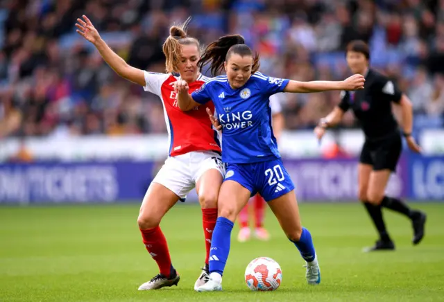 Missy Goodwin of Leicester City is challenged by Lia Walti