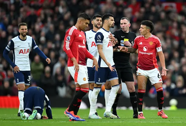 Lisandro Martinez of Manchester United clashes with Dominic Solanke