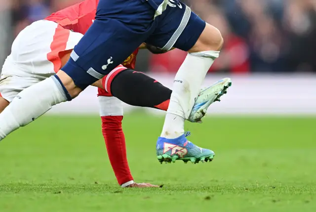 James Maddison of Tottenham Hotspur is fouled by Bruno Fernandes