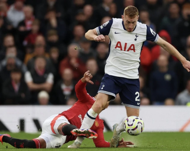 Dejan Kulusevski in action with Manchester United's Casemiro