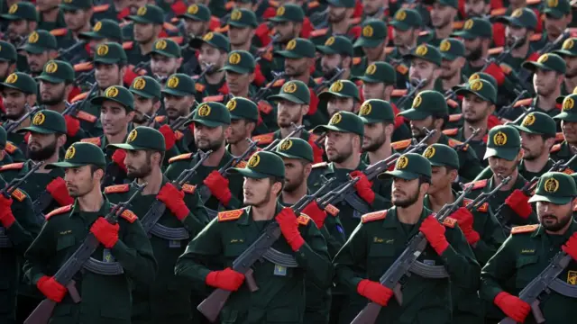 Iranian Revolutionary Guard Corps (IRGC) soldiers march in formation during the annual military parade