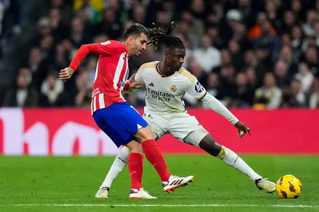 Eduardo Camavinga of Real Madrid battle for the ball with Angel Correa