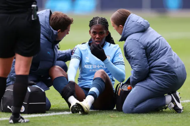 Khadija Shaw of Manchester City receives medical treatment