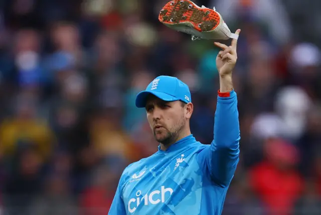 England's Liam Livingstone holds Matthew Potts shoe in the air