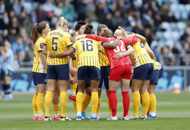 Brighton players huddle