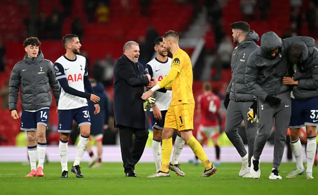 Ange Postecoglou, Manager of Tottenham Hotspur, interacts with Guglielmo Vicario