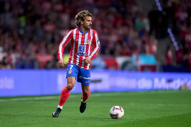 Antoine Griezmann of Atletico de Madrid runs with the ball