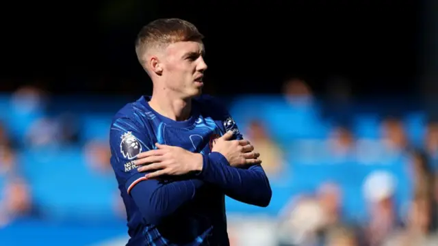 Cole Palmer of Chelsea celebrates scoring his team's first goal during the Premier League match between Chelsea FC and Brighton & Hove Albion FC at Stamford Bridge on September 28, 2024 in London, England.