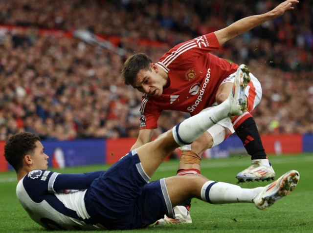 Brennan Johnson in action with Manchester United's Manuel Ugarte