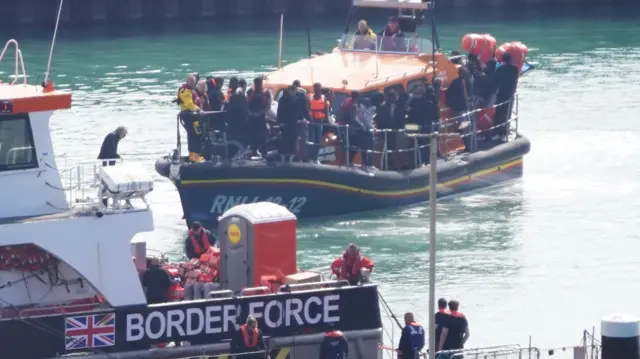 A group of people thought to be migrants are brought in to Dover, Kent, onboard the RNLI Dungeness Lifeboat following a small boat incident in the Channel