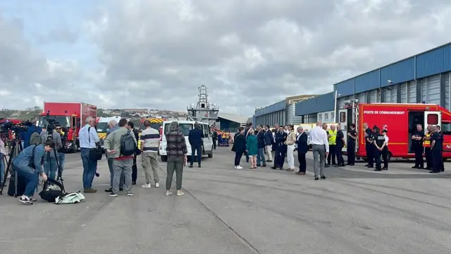 French rescue forces, authorities and members of media are seen in the port of Boulogne-sur-Mer after several migrants died as their boat capsized on its way across the Channel to Britain, France, September 3, 2024.