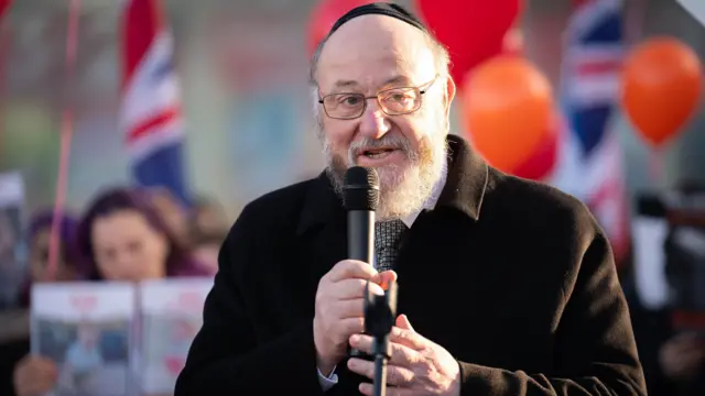 Chief Rabbi Ephraim Mirvis speaks during a vigil at Keystone Passage in Borehamwood for victims and hostages of Hamas attacks