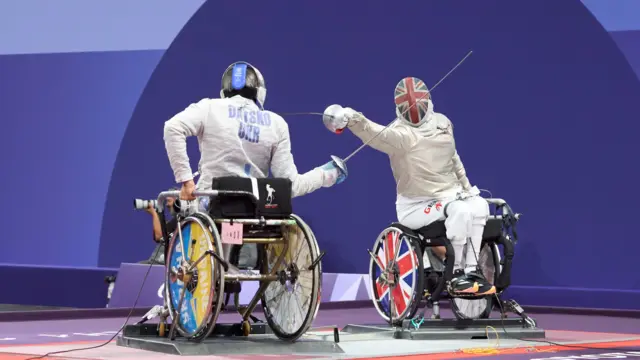 Dimitri Coutya in wheelchair fencing action