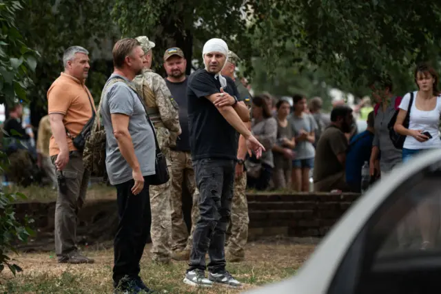 An injured man near the military institute that was attacked in Poltava