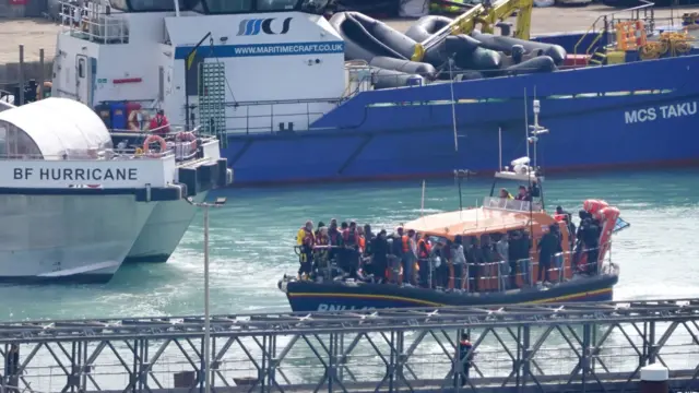 A group of people thought to be migrants are brought in to Dover, Kent, onboard the RNLI Dungeness Lifeboat following a small boat incident in the Channel.