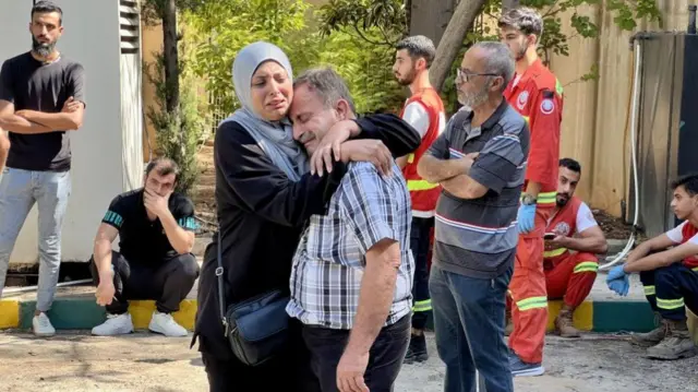 Relatives of victims of an Israeli air strike in Ain, southern Lebanon, in which 45 people people were killed on Sunday (picture taken Monday)