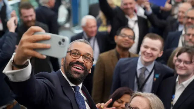 James Cleverly takes a selfie with Tory conference attendees