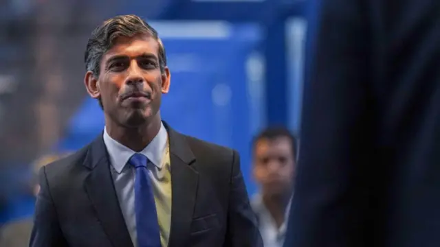 Rishi Sunak, Leader of the Conservative party walks to attend a reception for party members at the Conservative Party Conference at Birmingham ICC Arena on September 29, 2024 in Birmingham, England.