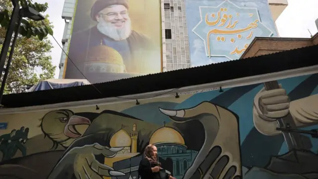 A billboard with a picture of the late Lebanon's Hezbollah leader Hassan Nasrallah is displayed on a building in Tehran