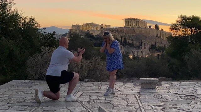 Thomas Mackintosh and Paige in Athens as Tom proposes