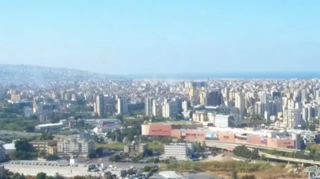 A view of southern beirut with smoke rising