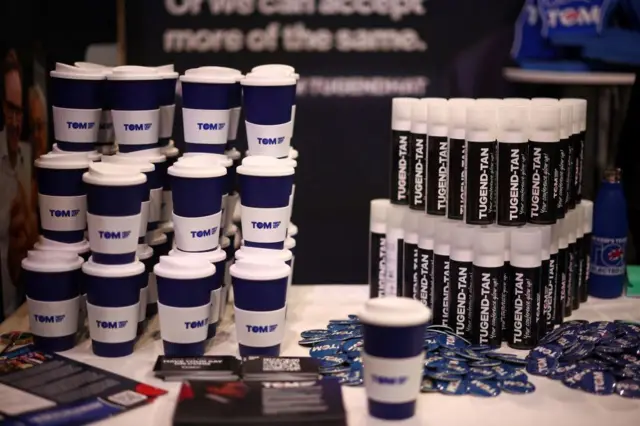 Some merchandise is seen at the stand for leadership candidate Tom Tugendhat on the first full day at the annual Conservative Party Conference in Birmingham, central England, on September 29, 2024.