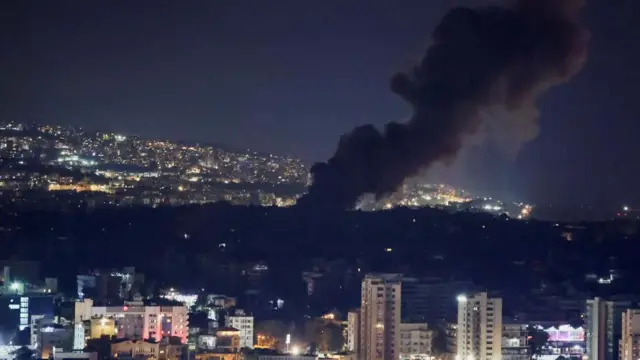 Smoke rises over Beirut's southern suburbs after a strike, amid ongoing hostilities between Hezbollah and Israeli forces, as seen from Sin El Fil, Lebanon