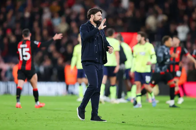 Russell Martin, manager of Southampton, gestures an apology to the travelling supporters