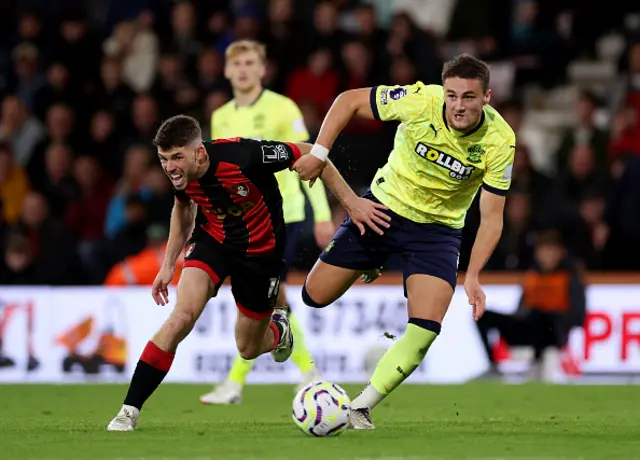 Taylor Harwood-Bellis of Southampton is challenged by Ryan Christie