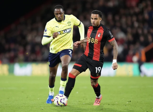 Joe Aribo and Bournemouth's Justin Kluivert (right) battle for the ball d