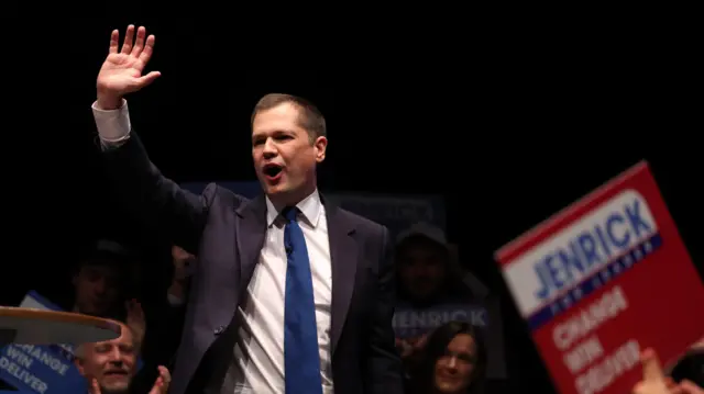 Robert Jenrick gestures as he speaks at an event during the Conservative Party Conference