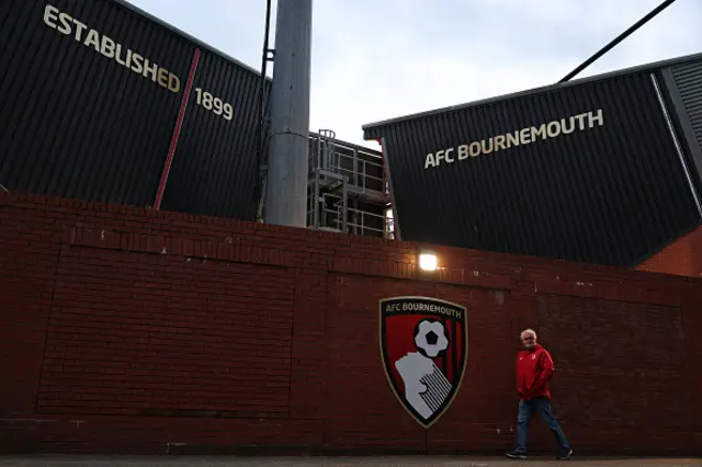 A supporter arrives at the ground